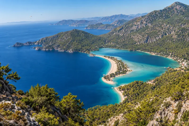 The turquoise Blue Lagoon of Oludeniz near Fethiye seen from the pine-covered slopes of Babadag