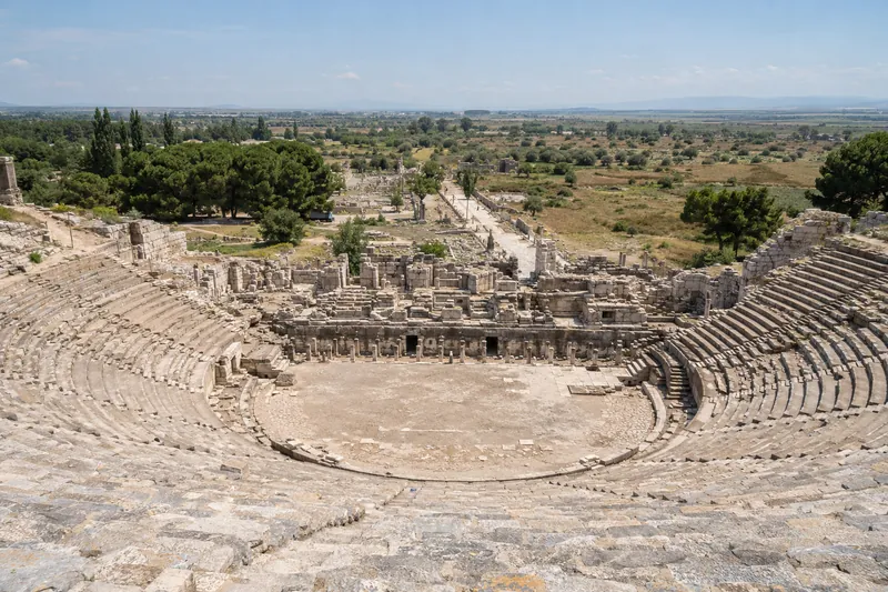 The Great Theatre of Ephesus seen from the top rows, the Harbor Street running toward the plain