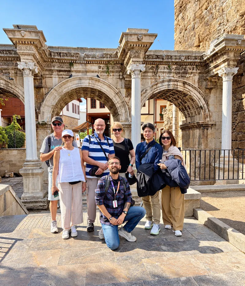 Turkey Itineraries guests. At Hadrian's Gate in Kaleiçi, Antalya