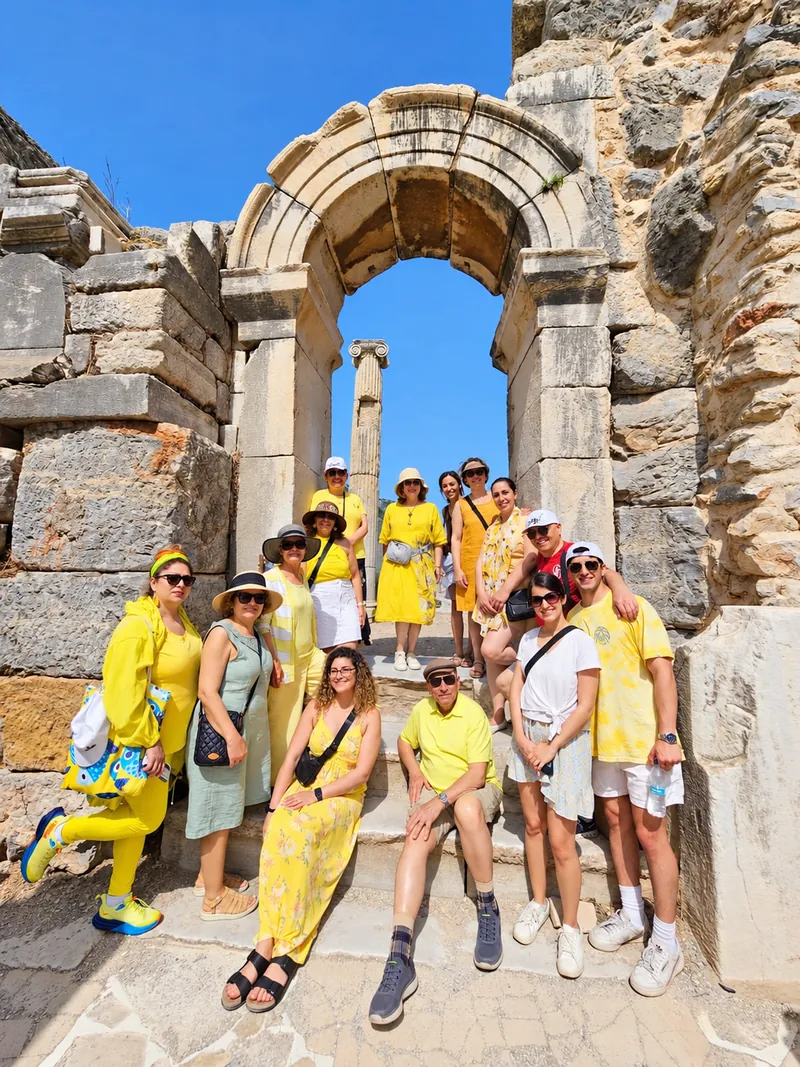 Turkey Itineraries guests. A group of friends at an ancient gateway, Ephesus