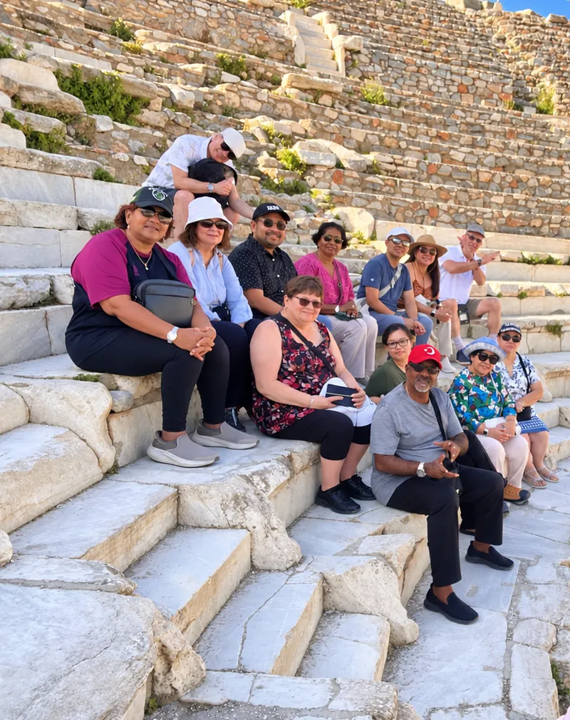 Turkey Itineraries guests. Resting on the steps of the Odeon, Ephesus