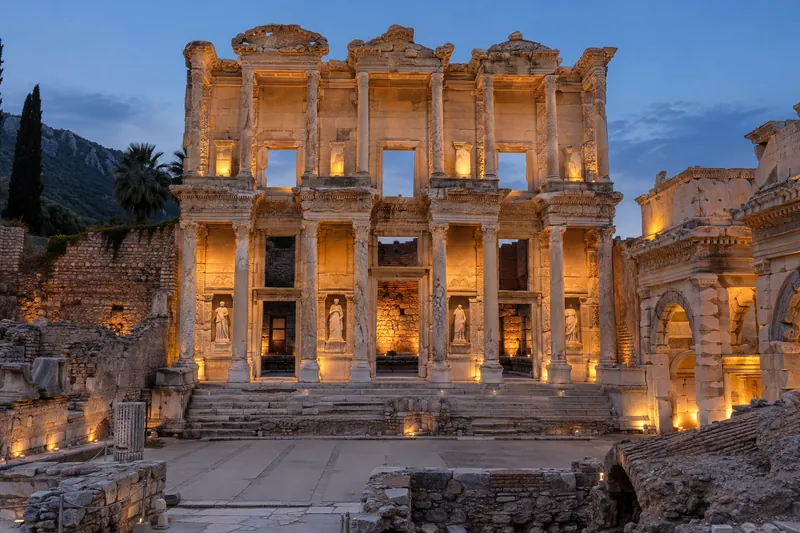 The Library of Celsus in Ephesus softly lit at dusk