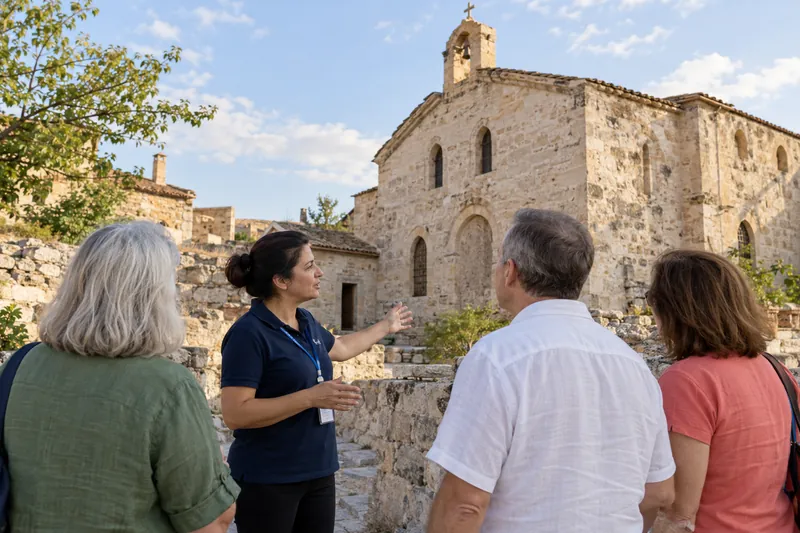 A private guide in front of the old Greek church in Cemil village, Cappadocia