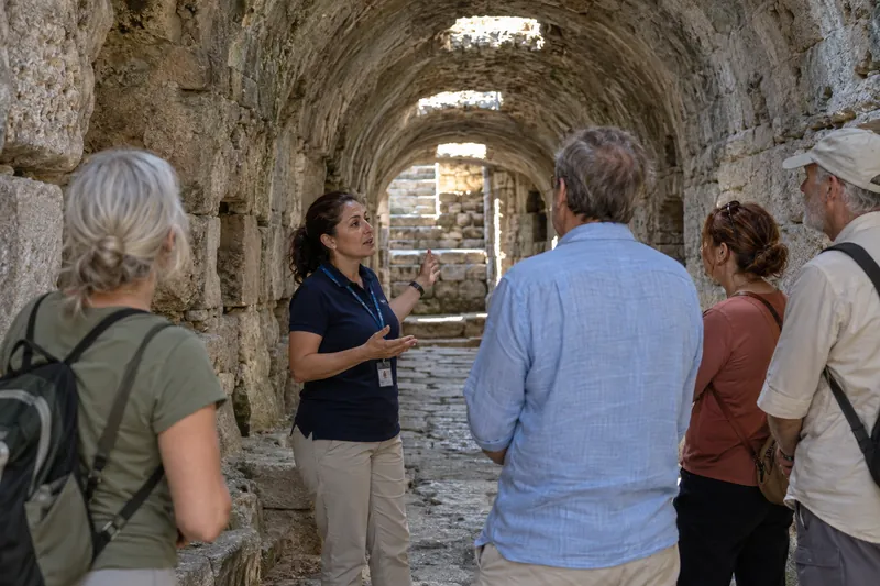 A private guide in the vaulted sacred tunnel of the Asclepion of Pergamon