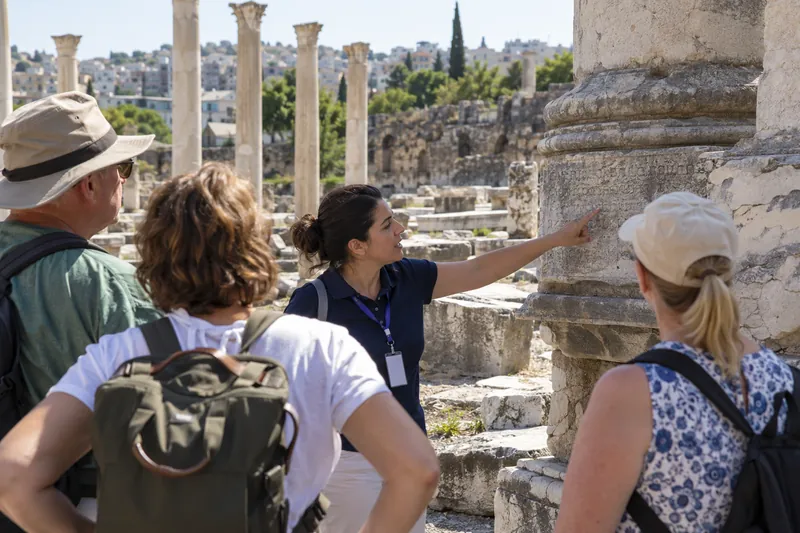 A private guide pointing out an ancient Greek inscription on a column in the Agora of Smyrna, Izmir